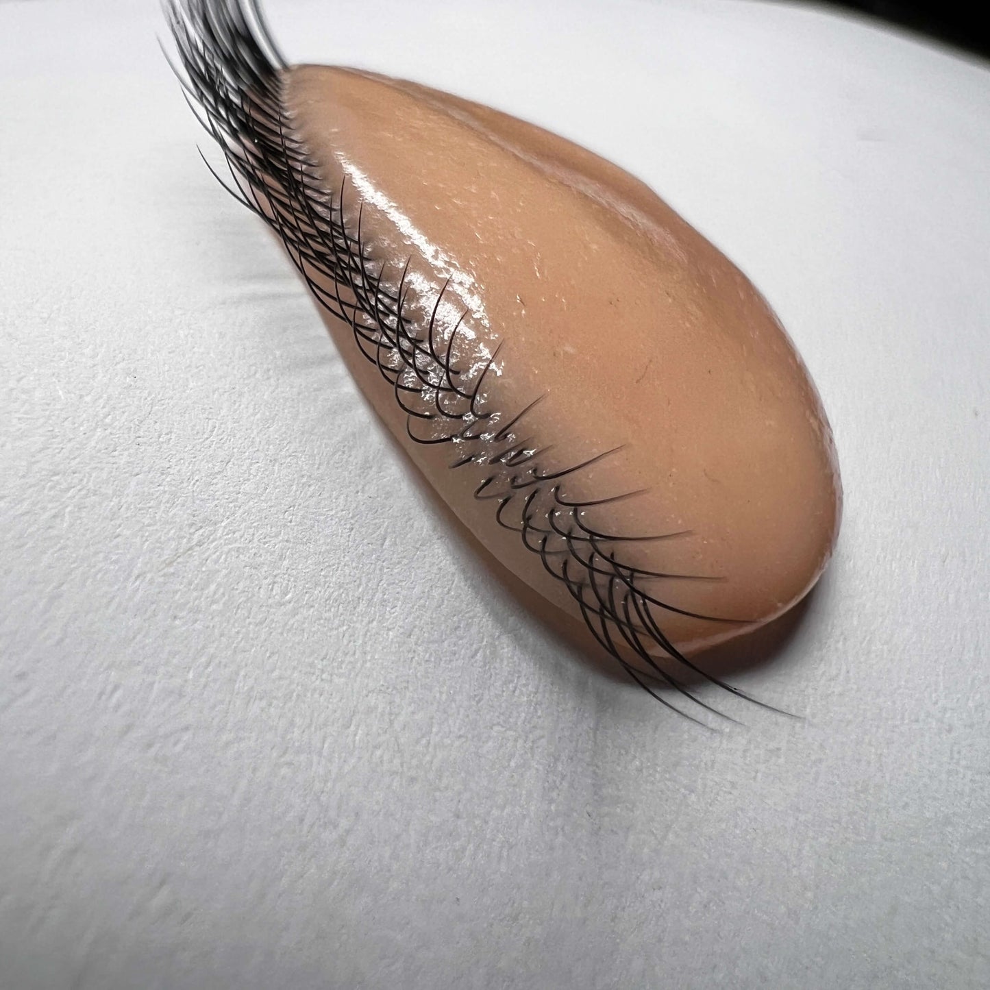 False eyelash on silicone on a white background