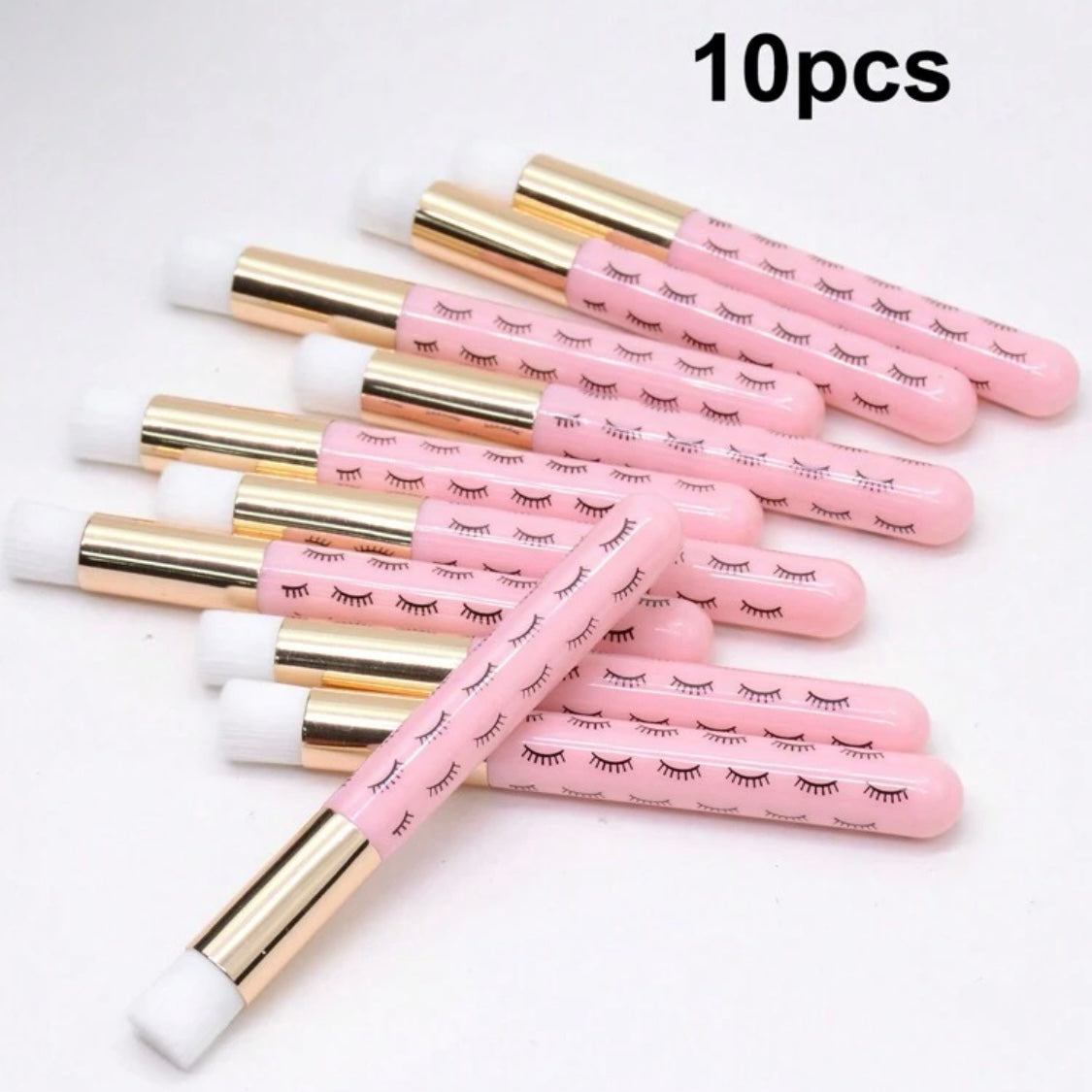 Pink eyelash shampoo brushes – top-down arrangement