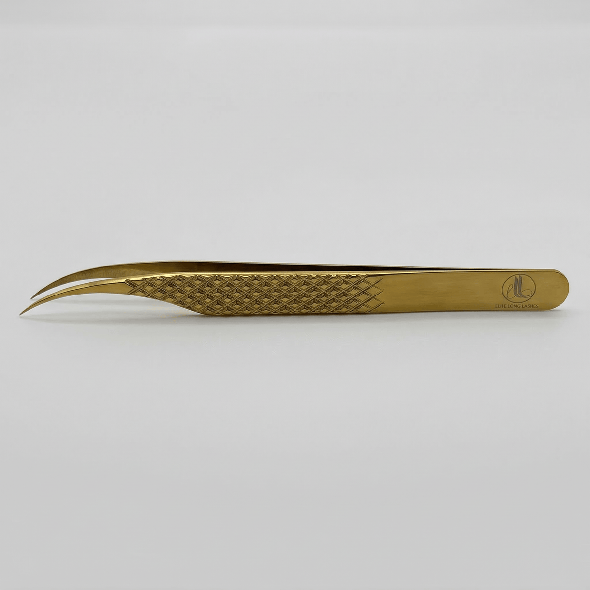 Golden Dolphin J-shape isolation tweezer for eyelash extensions – gold on gray background