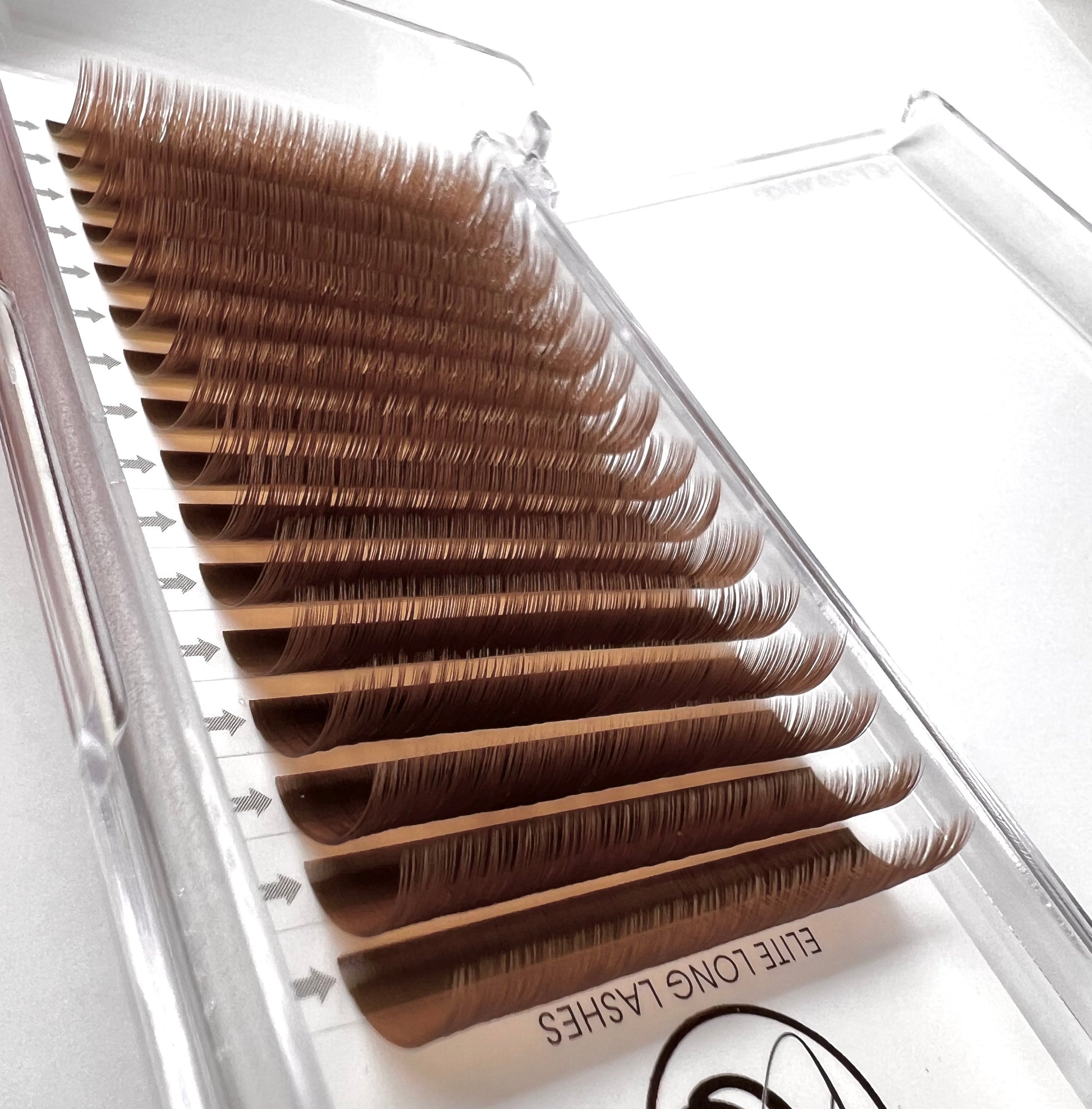 A tray of brown, matte mink eyelash extensions. 16 lash lines per tray.