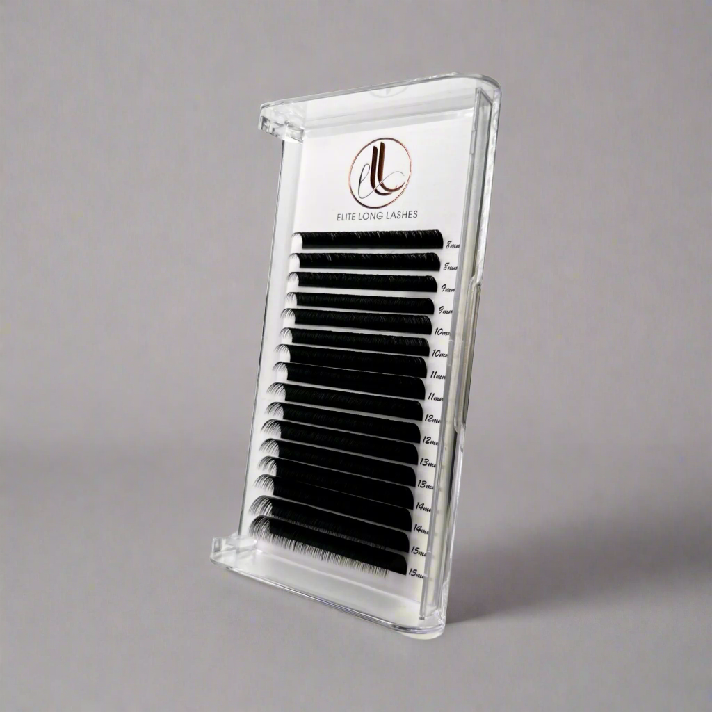 A tray of false eyelashes in a matte black color, displayed in a clear plastic case with a brand logo on the top.
