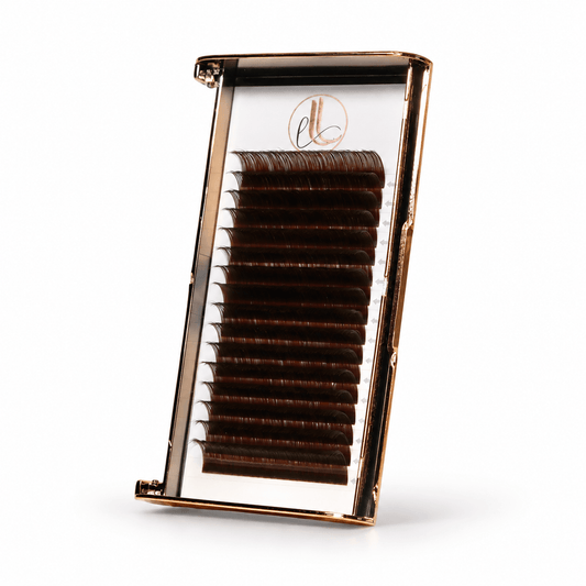 Elite Long Lashes dark brown cashmere lash extensions in a rose-gold-edged tray on a soft white background.