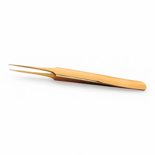 Elite Long Lashes Gold Needle Nose I-Shape isolation tweezer with fine straight tips on a soft white background.
