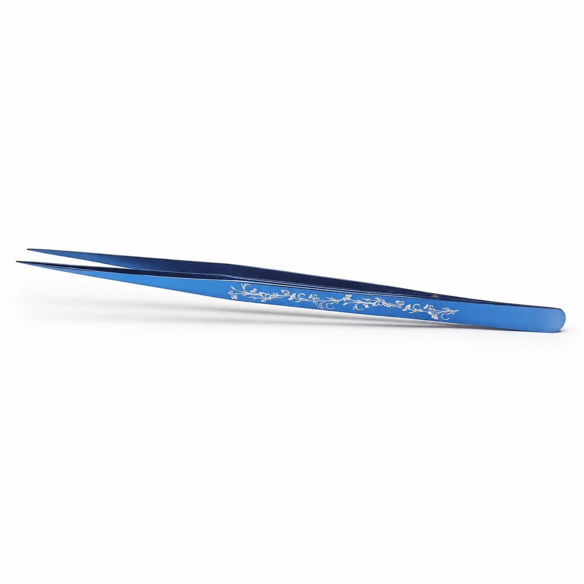 Elite Long Lashes Navy Vine Blossom blue I-shape isolation lash tweezer with a silver floral design on a soft white background.