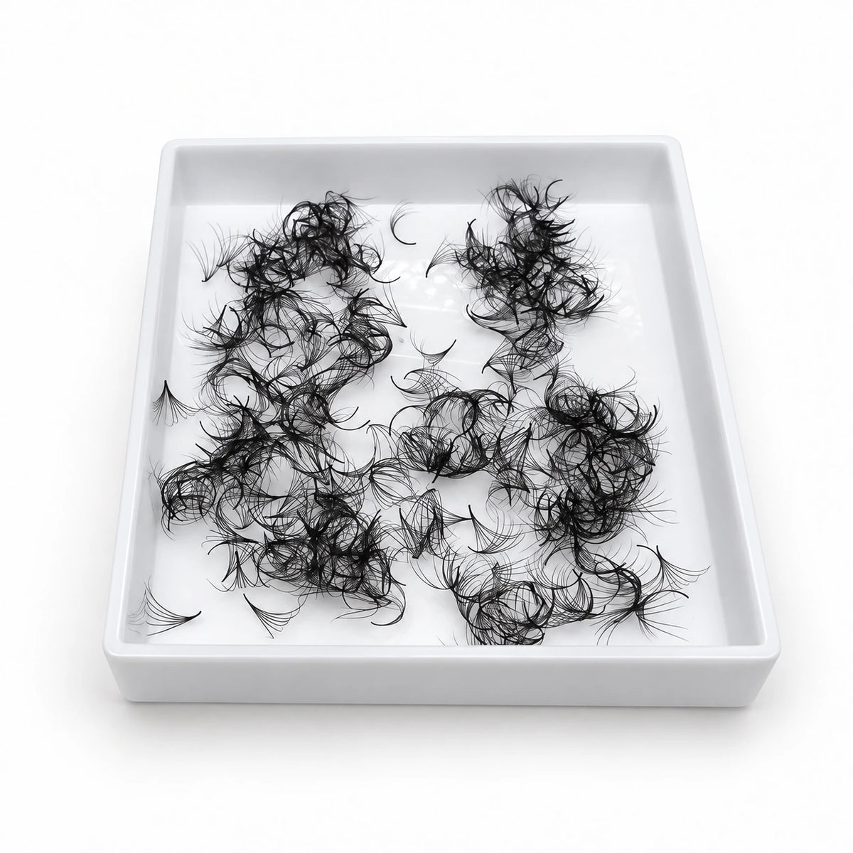 Elite Long Lashes 500-count 0.05 mm Promade loose volume fans in a single open white tray on a soft white background.
