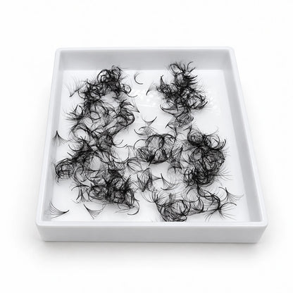 Elite Long Lashes 500-count 0.05 mm Promade loose volume fans in a single open white tray on a soft white background.