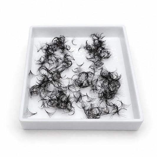 Elite Long Lashes 500-count 0.05 mm Promade loose volume fans in a single open white tray on a soft white background.
