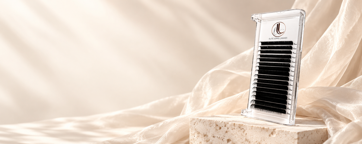 Matte black lash tray on ivory travertine with cream fabric; collection banner