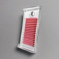 A tray of pink cashmere eyelash extensions with 0.07mm thickness, arranged in parallel lines, packaged in a clear plastic case with a gray background