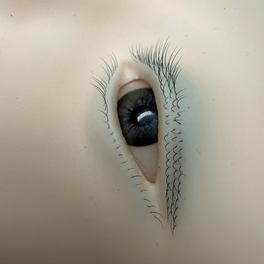 Large silicone lash practice face showing both eyes, nose bridge and brow area